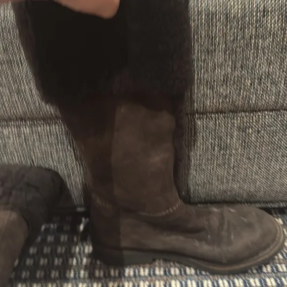 - Suede Shearling Knee High Boots in the color brown