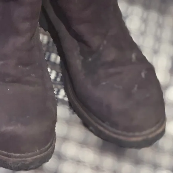 - Suede Shearling Knee High Boots in the color brown