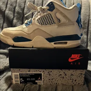 Air Jordan 4 Retro White Blue Sneakers
