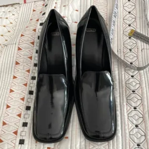 Coach, black patent leather heeled, loafers size 10