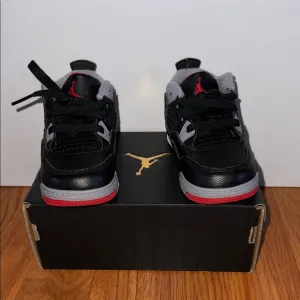EUC Jordan 4 Retro Kids Black and Red Sneakers