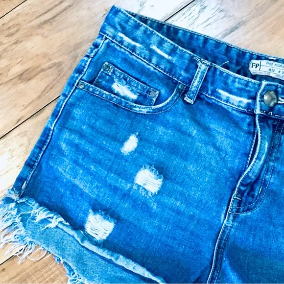 Free People denim blue jean shorts distressed cut off style 32” waist