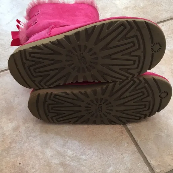 Girl’s UGG boots with bows on the back