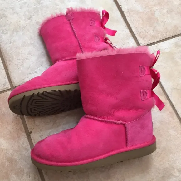 Girl’s UGG boots with bows on the back
