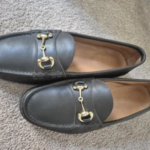 Gold and Black Loafers with Horsebit Detail
