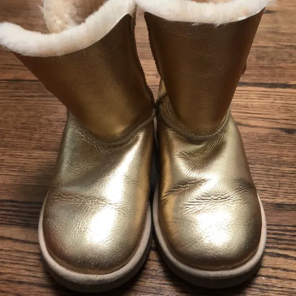 Gold UGG Button Up Boots. NWOT size 4