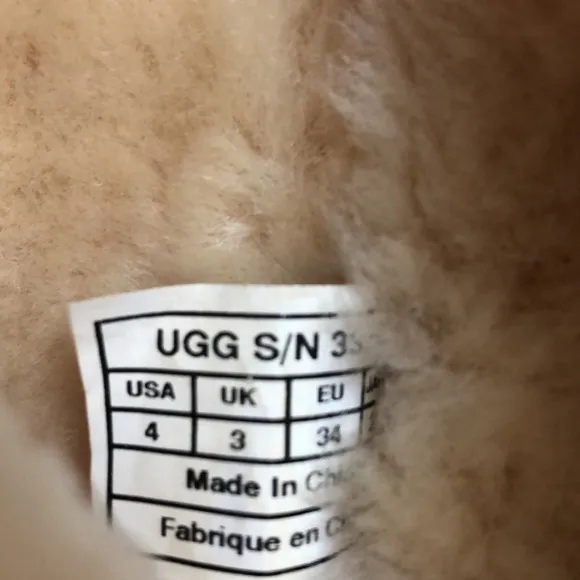 Gold UGG Button Up Boots. NWOT size 4