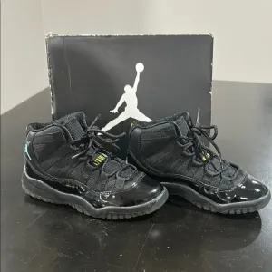 JORDAN 11 RETRO Kid’s Black Jordan Sneakers