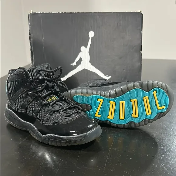 JORDAN 11 RETRO Kid’s Black Jordan Sneakers