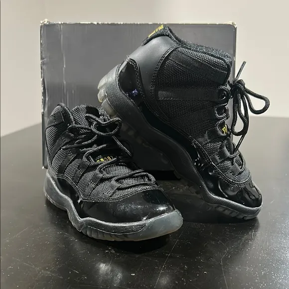 JORDAN 11 RETRO Kid’s Black Jordan Sneakers