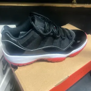 Jordan Men's Black and Red Sneakers Retro 11