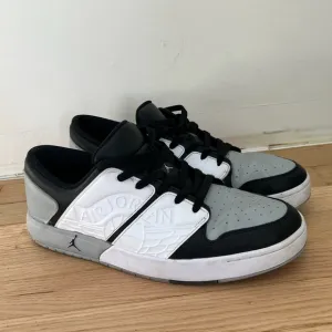 Jordan Men's NU Retro Black and White Sneakers
