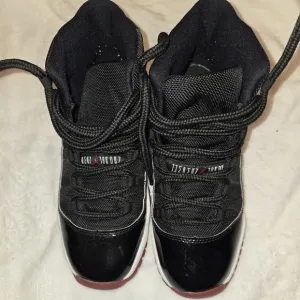 Kids Black and Red Jordan Sneakers
