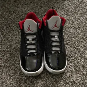 Kids' Black and Red Jordan Sneakers