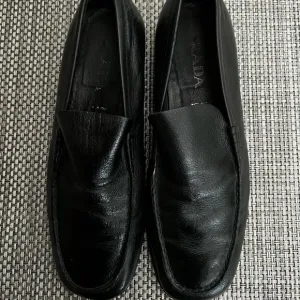 Men’s “PRADA” Black Leather Loafers