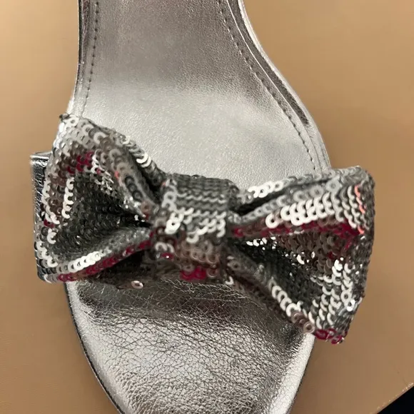 Michael Kors Paris Sequin Bow Silver High Heel. new never worn