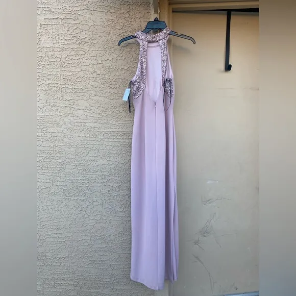 NWT Vince Camuto Halterneck Embellished dress has a high-cut hemline slit size 2