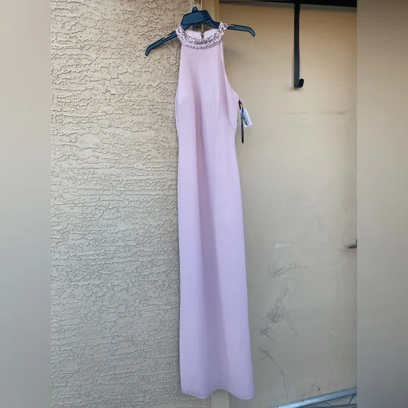 NWT Vince Camuto Halterneck Embellished dress has a high-cut hemline slit size 2