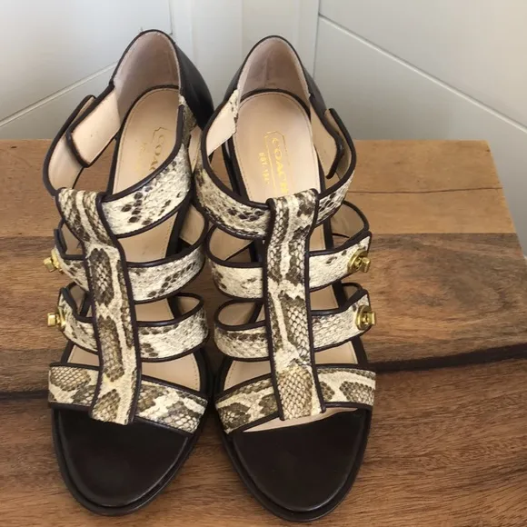 Stunning snakeskin print Tamarah heeled sandal with turn locks.