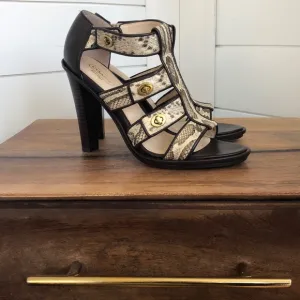 Stunning snakeskin print Tamarah heeled sandal with turn locks.