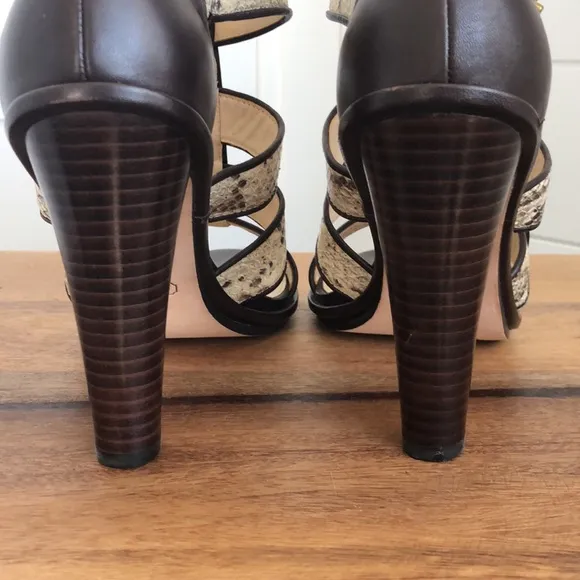 Stunning snakeskin print Tamarah heeled sandal with turn locks.
