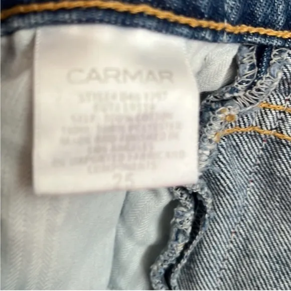 Three Carmar denim mini skirts, size 25. Two blue and one black.