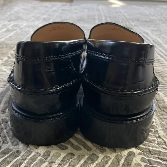 Tod's Black Leather Loafers with Gold Accent