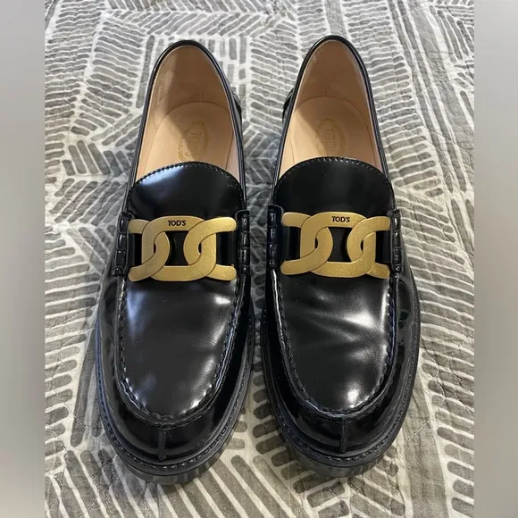 Tod's Black Leather Loafers with Gold Accent
