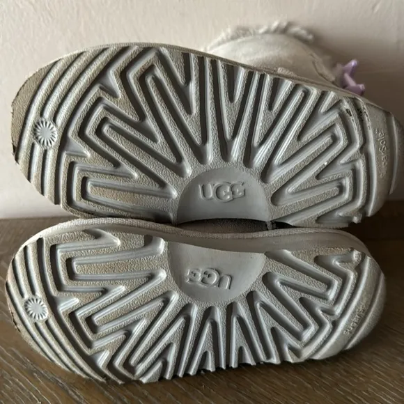 UGG gray boots with lavender bows. Little girl size 9