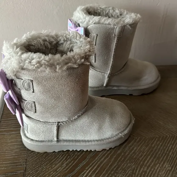 UGG gray boots with lavender bows. Little girl size 9