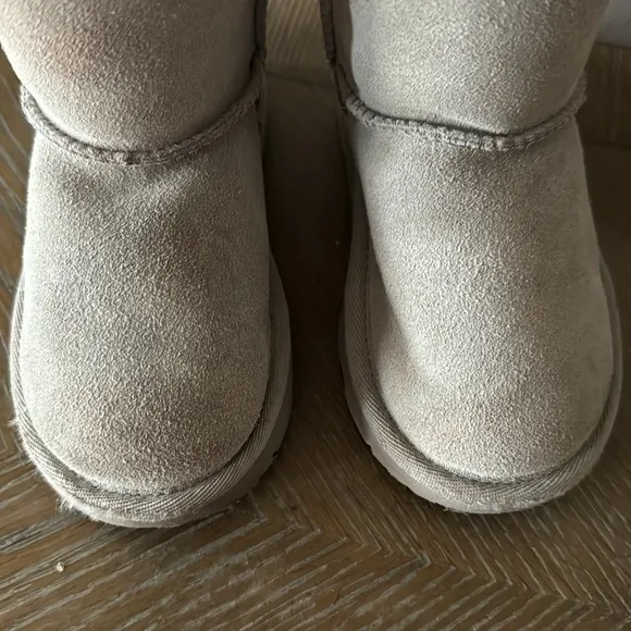 UGG gray boots with lavender bows. Little girl size 9
