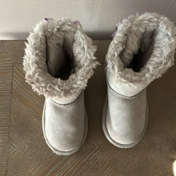 UGG gray boots with lavender bows. Little girl size 9