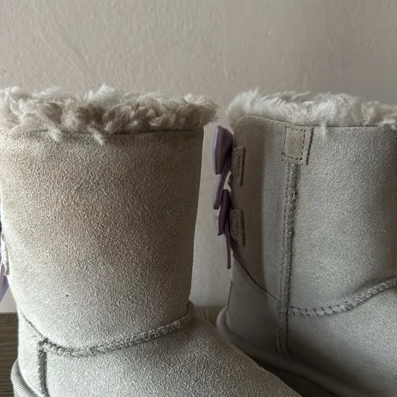 UGG gray boots with lavender bows. Little girl size 9