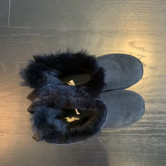 Ugg size four black brand new boots. Never worn.
