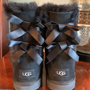 Ugg size four black brand new boots. Never worn.