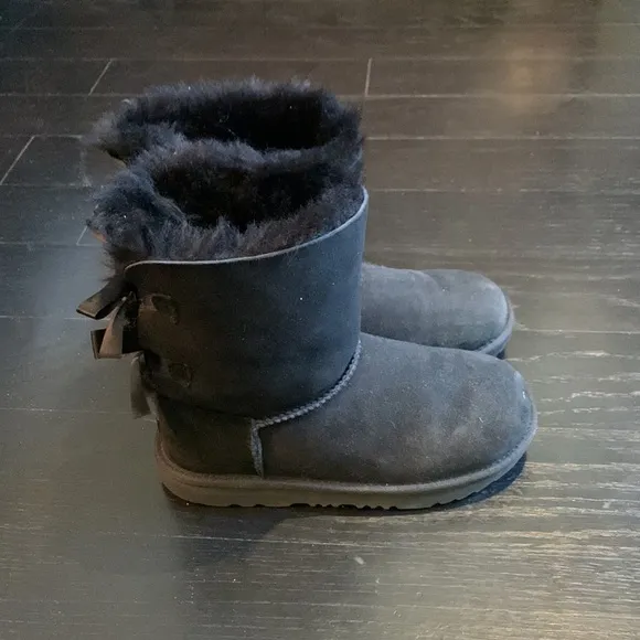 Ugg size four black brand new boots. Never worn.