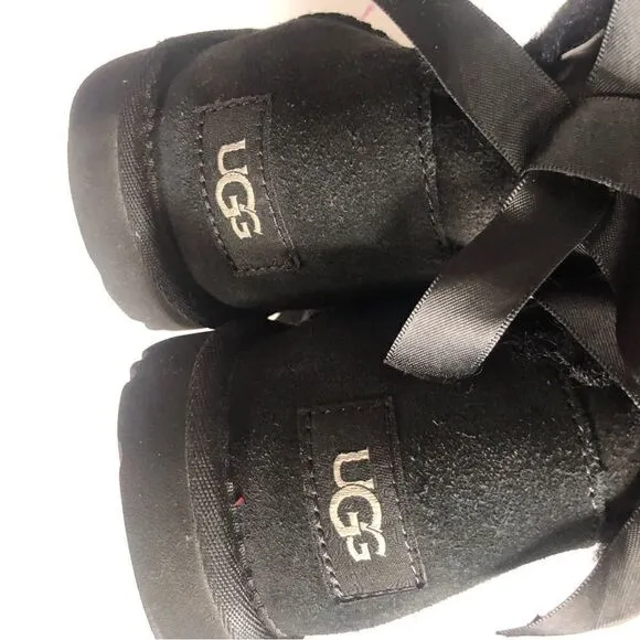 UGG two Bailey bow black ankle shearling lined slip on boots size 6