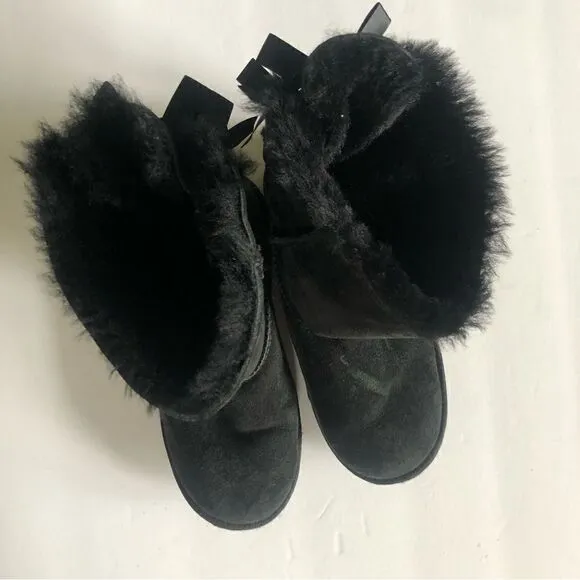 UGG two Bailey bow black ankle shearling lined slip on boots size 6