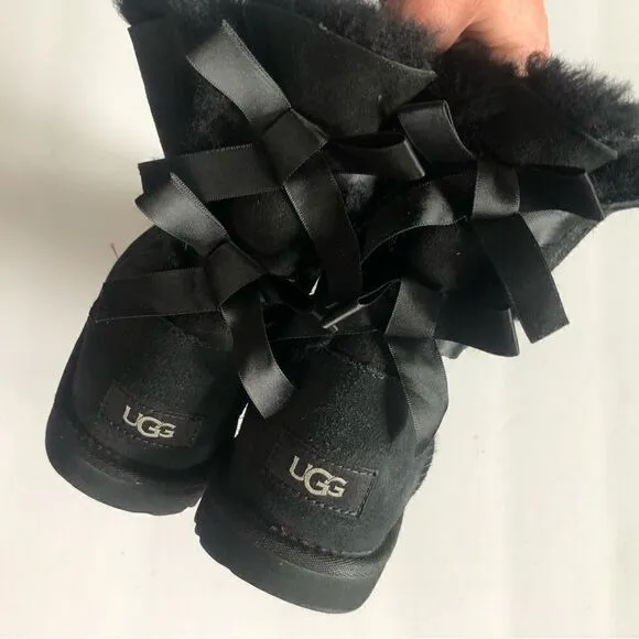 UGG two Bailey bow black ankle shearling lined slip on boots size 6