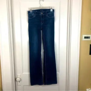 WHBM &quot;The Boot&quot; denim mid-rise blue jeans size 0